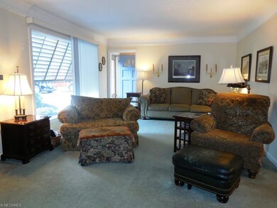 Welcoming front entry with wood floors under carpe