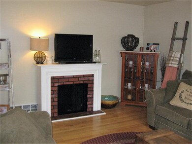 Living room with decorative fireplace.