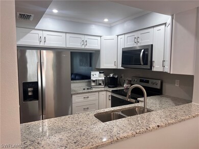 Kitchen with tasteful backsplash, stainless steel