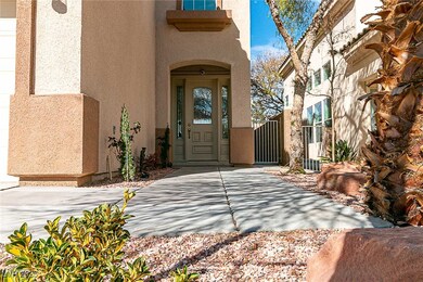 Doorway to property featuring a gate and stucco si
