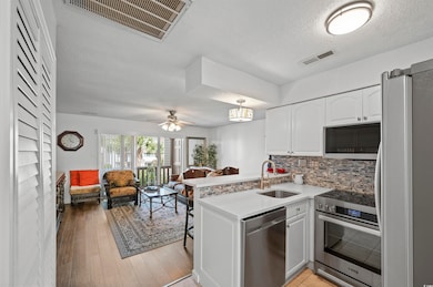 Kitchen featuring stainless steel appliances, ligh