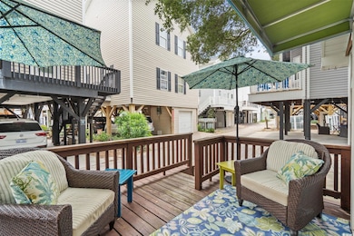 Wooden terrace with an attached garage