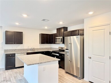 Kitchen with appliances with stainless steel finis
