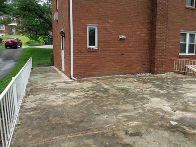 Exterior Front. Large cement deck in back