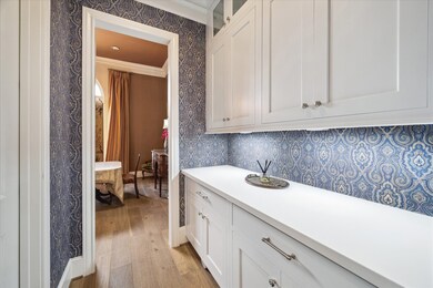 Through the kitchen is the butler's area which con