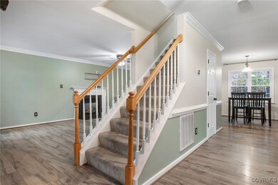 Stairway with wood-type flooring and ornamental mo