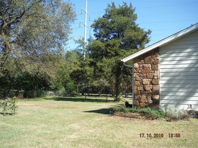 South side of house showing yard from front.