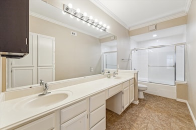 The primary bath features a vanity and lovely tile