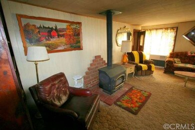Living Room with wood stove & monitor heater.