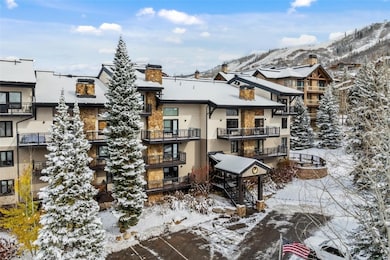 Snow covered building featuring a mountain view