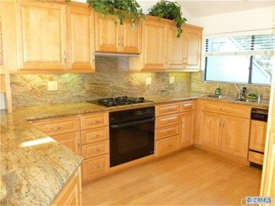 Upgraded kitchen with Maple wood cabinets, granite