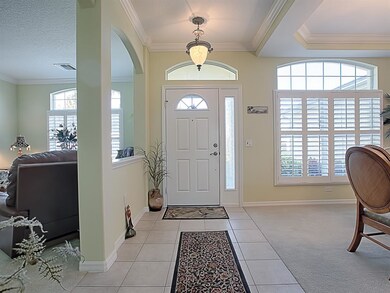 Light and bright foyer with dining room and living