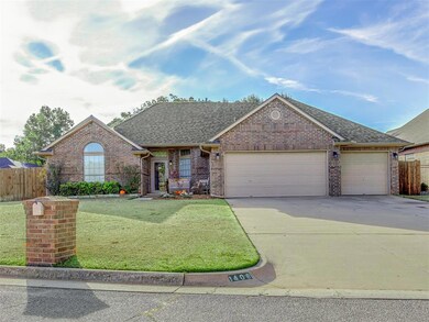 Single story home featuring a front lawn and a gar