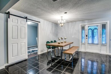 Dining area off the entry. Third bedroom through t