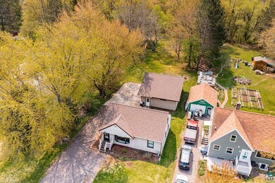 View of subject property with a heavily wooded area