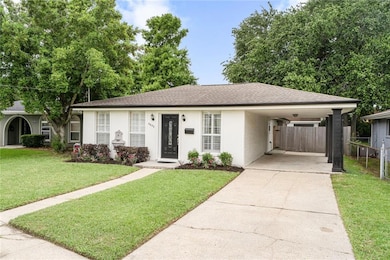 FRESHLY LANDSCAPED WITH COVERED CARPORT