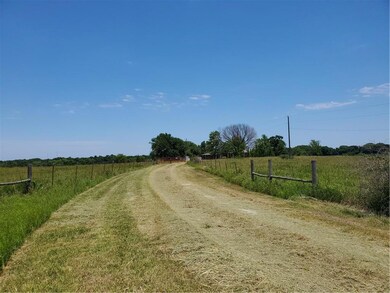 View approaching the cattle gate from the road.