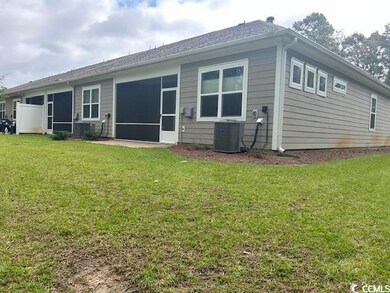 Back of house featuring central air condition unit