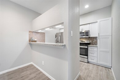 The kitchen has been extensively remodeled with br