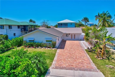 View of front of property with decorative driveway