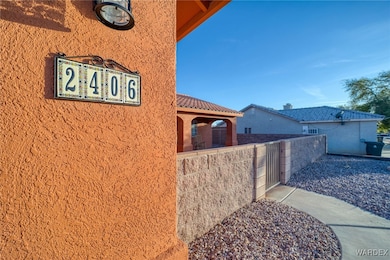 View of home's exterior with stucco siding and a t