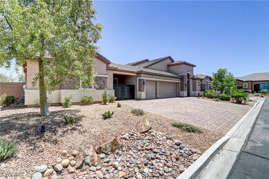 View of front of house with decorative driveway, a