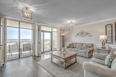 Living room with floor to ceiling windows, a water