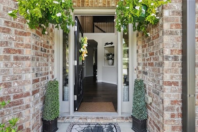Doorway to property with brick siding