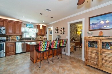 KITCHEN WITH BREAKFAST BAR. *THE WALLPAPER IN THE 