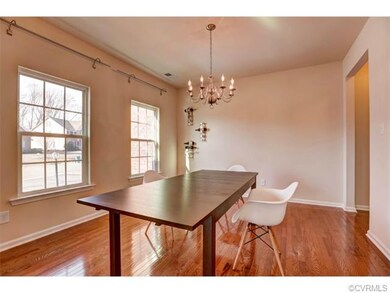 Hardwood Dining Room with Chandelier