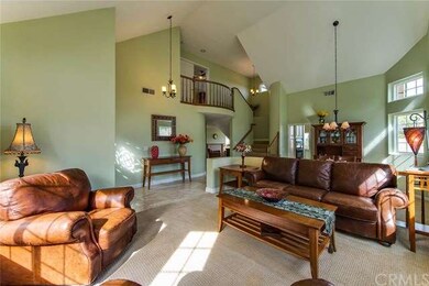Inviting Living Room with vaulted ceilings