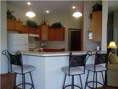 View of kitchen from the back of the house, with e