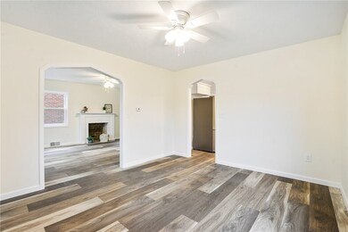 Dining room sits between living room and kitchen.