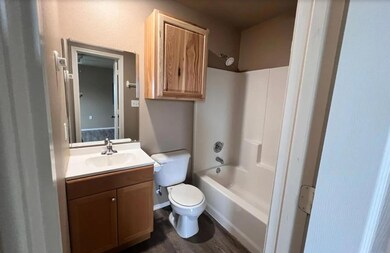 Bathroom featuring tub / shower combination, toile