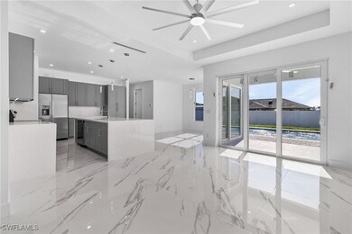 Kitchen featuring stainless steel fridge with ice