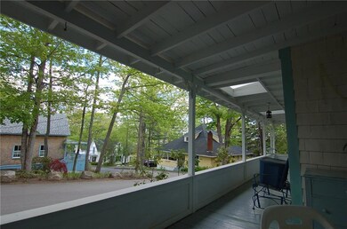Large wrap-around porch water view