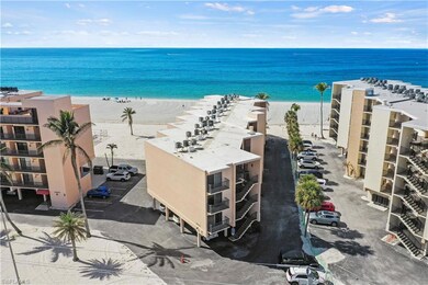 Drone / aerial view featuring a beach view and a w