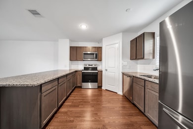 Stainless steel appliances included in home.