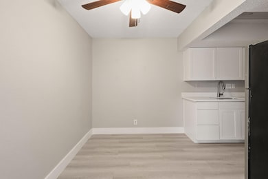 Unfurnished dining area featuring a ceiling fan, 