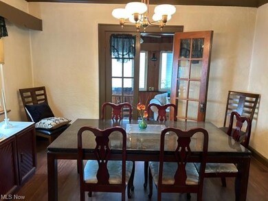 Dining room with french doors leading to sunroom