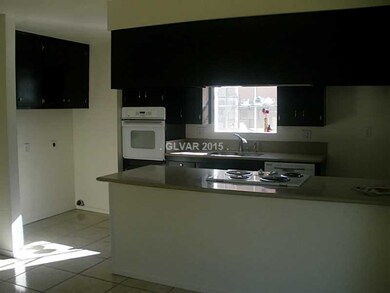 Property Photo. DARK CABINETS WITH NEW COUNTERTOPS