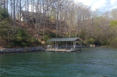 Wide deep cove location two lots from open water.