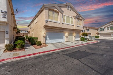 View of front of home with driveway, stucco siding