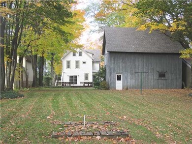 Exterior Back. Awesome half acre lot with plenty o