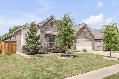 View of front of house featuring brick siding, an