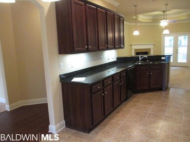 View of kitchen from breakfast area - note granite