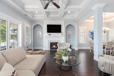 Living area featuring ceiling fan, a fireplace, a 