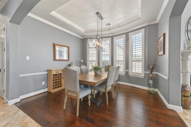 Formal dining has beaded tray ceiling, crown moldi