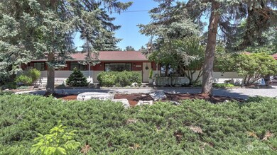 Enjoy established landscaping and a sprawling .5 acre corner lot with circular driveway and great street appeal!