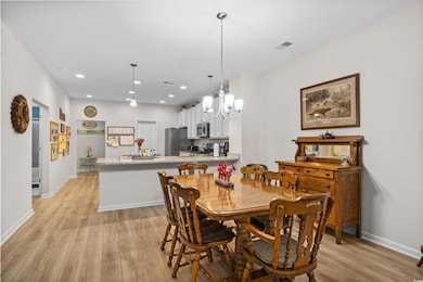 Dining space featuring light wood-type flooring, a